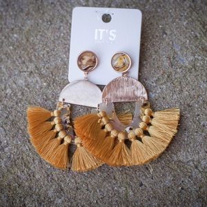 Gold tassel earnings